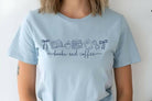 Books and coffee graphic tee by Anchored Grace Boutique, featuring a cozy book and coffee cup design on a casual t-shirt.