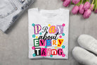 Black Pray About Everything graphic tee by Anchored Grace Boutique featuring religious text design on soft cotton fabric.