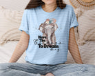 Have the Courage to Dream Big graphic tee by Anchored Grace Boutique, featuring inspirational text on a casual cotton T-shirt.