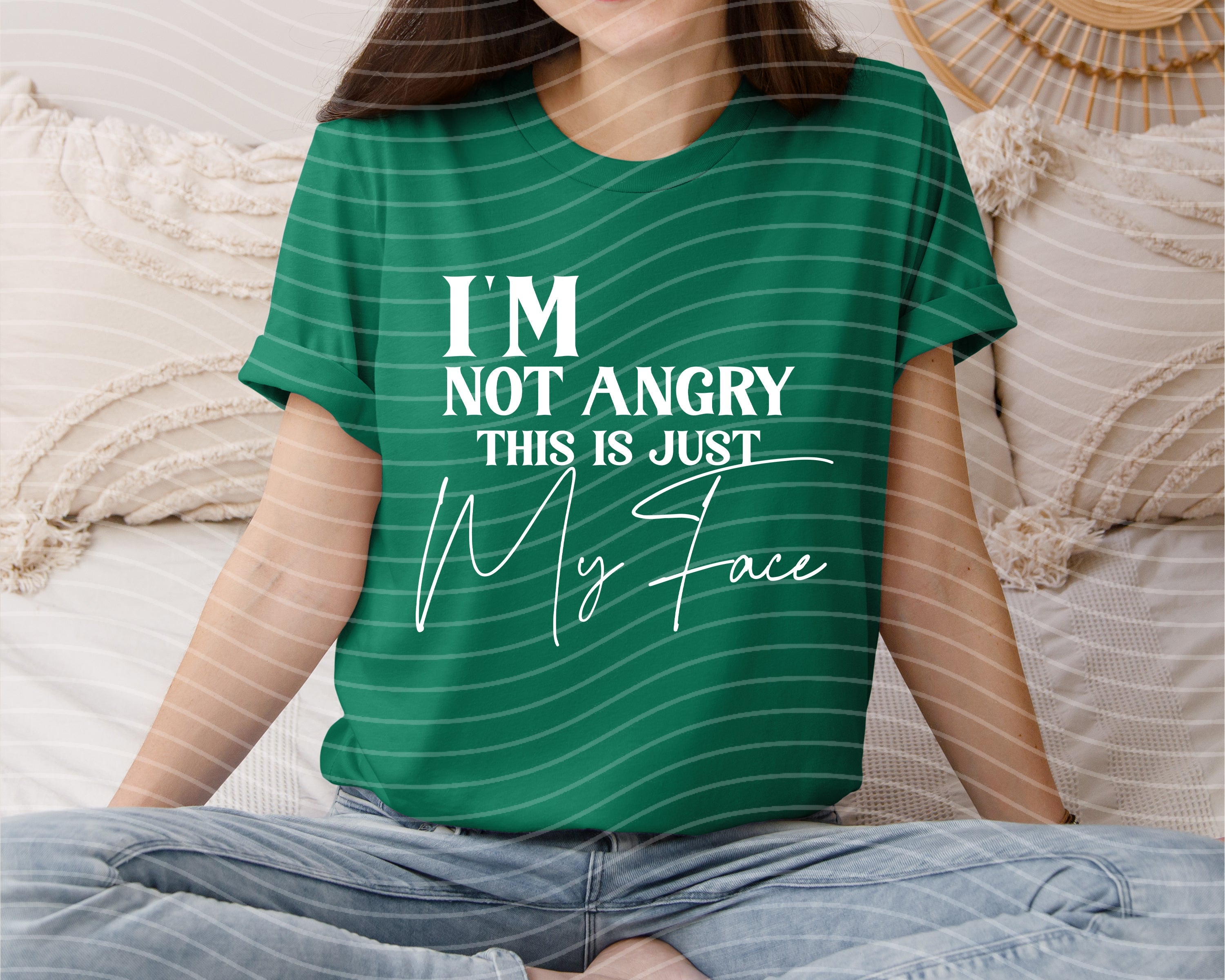 Black graphic tee from Anchored Grace Boutique with "I'm Not Angry This is Just My Face" printed design, casual and comfortable fit.