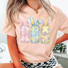 Bunny Dr Pepper graphic tee by Anchored Grace Boutique featuring a playful bunny and Dr Pepper logo on a casual t-shirt.