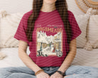 Hogsmeade graphic tee by Anchored Grace Boutique featuring a detailed illustrated design on soft fabric.