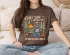 Graphic tee featuring "Only You Can Prevent Dumpster Fires" slogan, by Anchored Grace Boutique, displayed on a casual fit t-shirt.