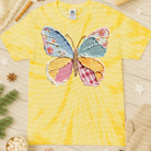 Colorful patchwork butterfly graphic tee for women by Anchored Grace Boutique, featuring vibrant butterfly design on casual tee.