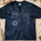 Supernatural Words graphic tee by Anchored Grace Boutique featuring a stylish design on a comfortable cotton shirt.