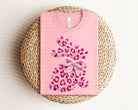 Fluffy leopard bunny graphic tee from Anchored Grace Boutique featuring a playful animal print design on soft fabric.