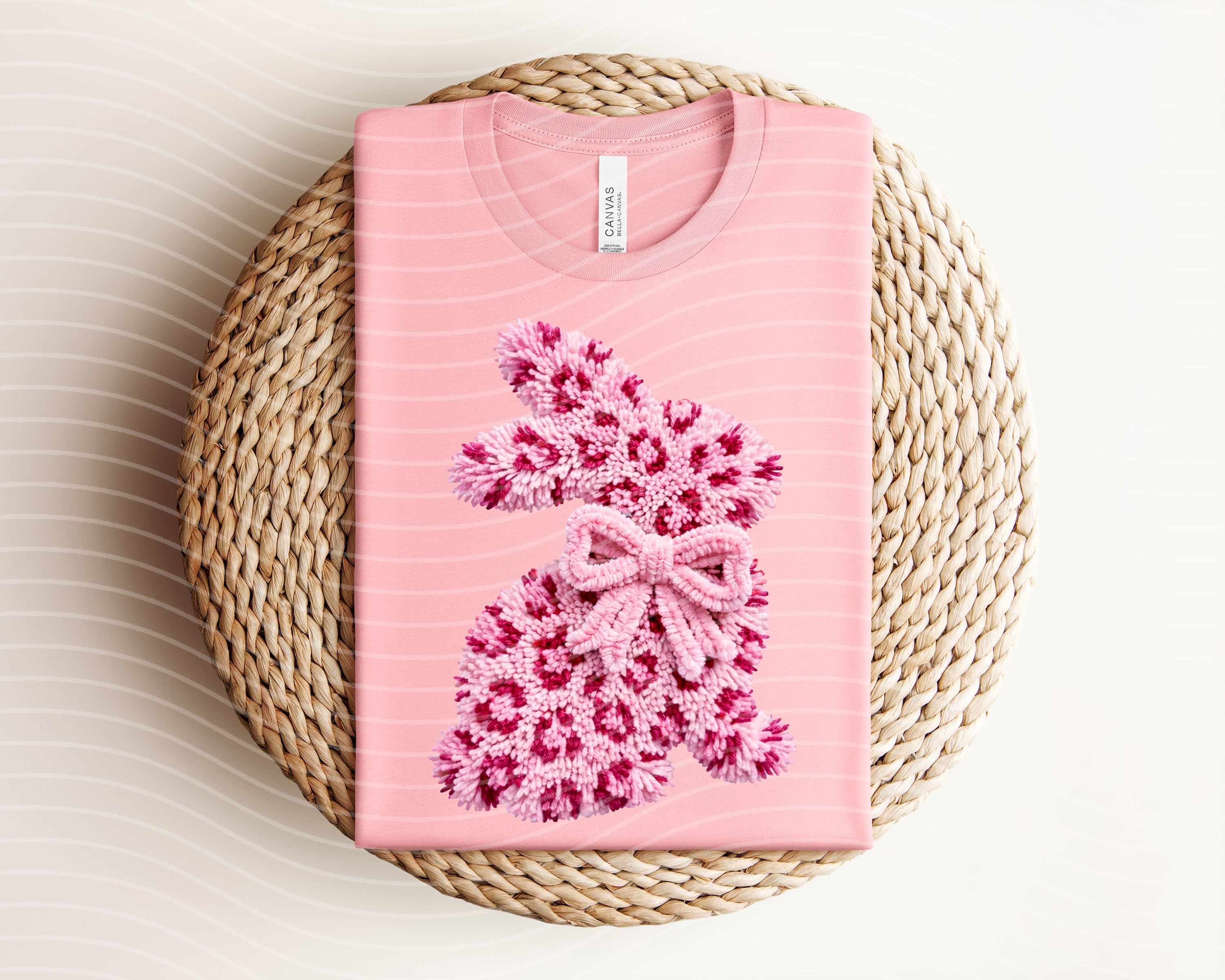 Fluffy leopard bunny graphic tee from Anchored Grace Boutique featuring a playful animal print design on soft fabric.