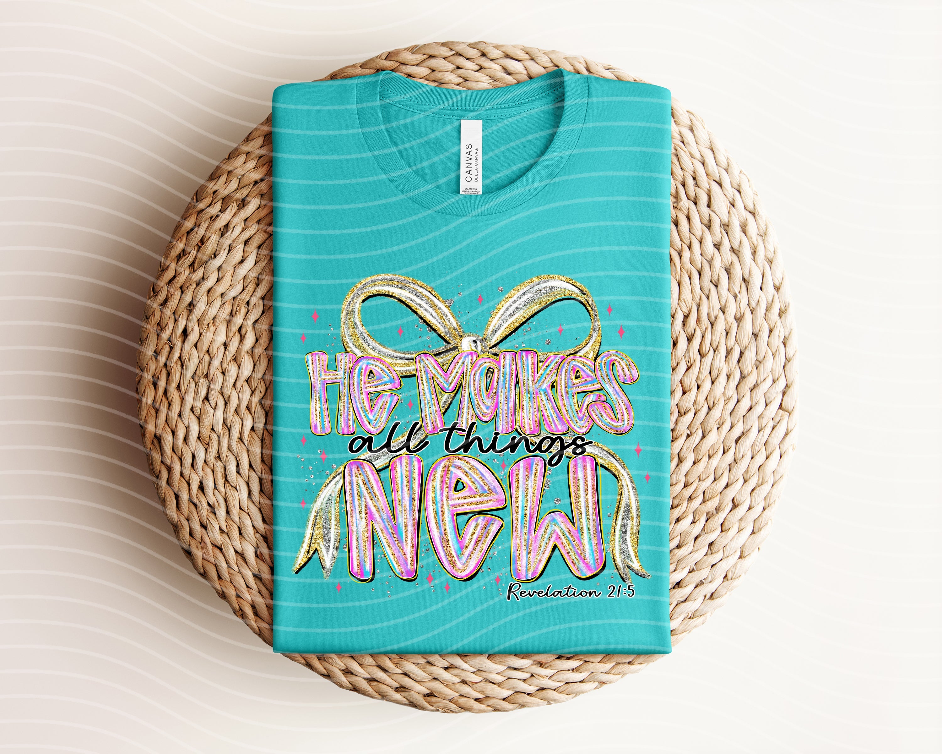 Black graphic tee featuring inspirational Christian phrase "He Makes All Things New" from Anchored Grace Boutique.