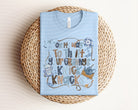 Graphic tee from Anchored Grace Boutique featuring "On My Way to Thrift Your Granny's Knick Knacks" design, casual and colorful.