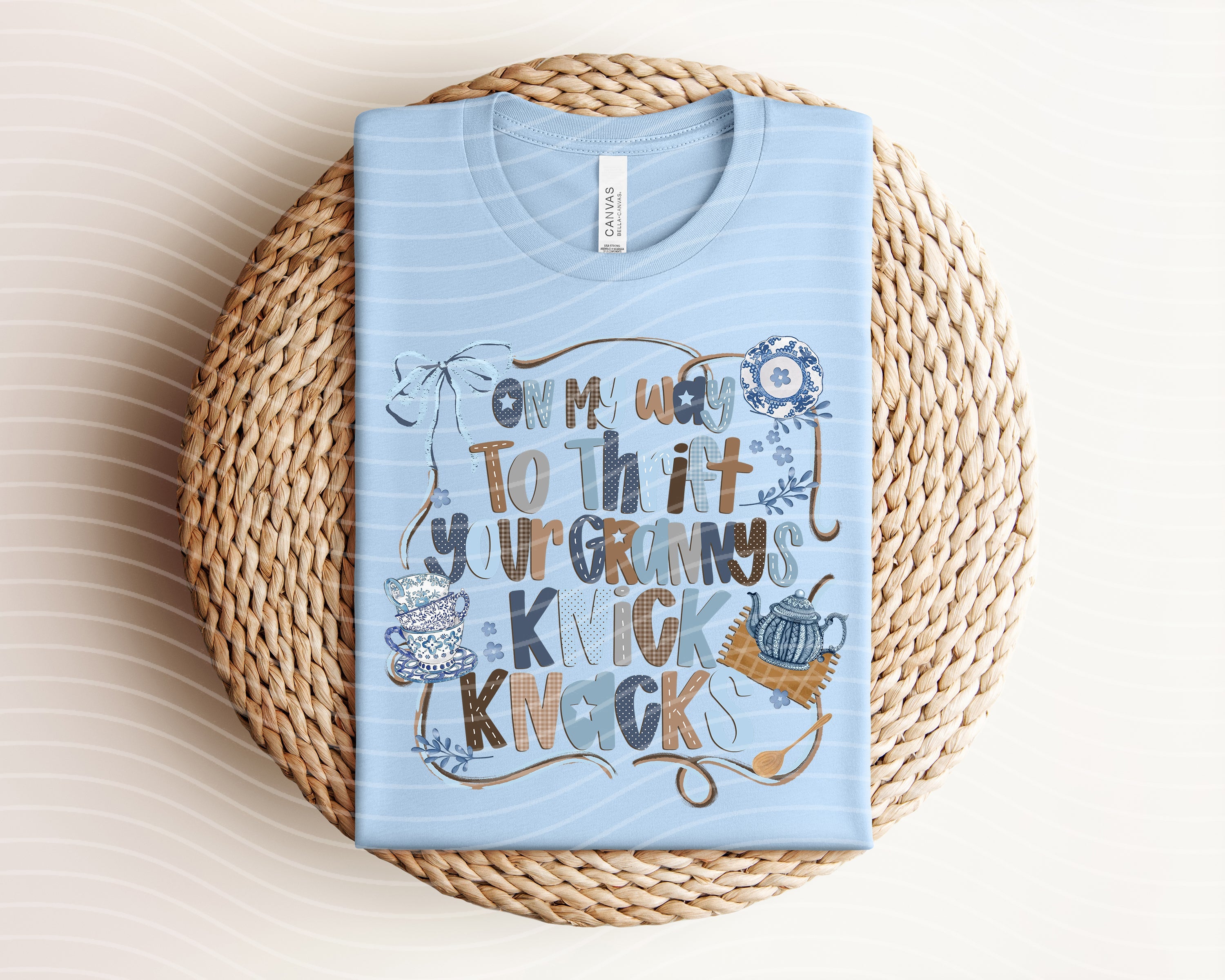Graphic tee from Anchored Grace Boutique featuring "On My Way to Thrift Your Granny's Knick Knacks" design, casual and colorful.