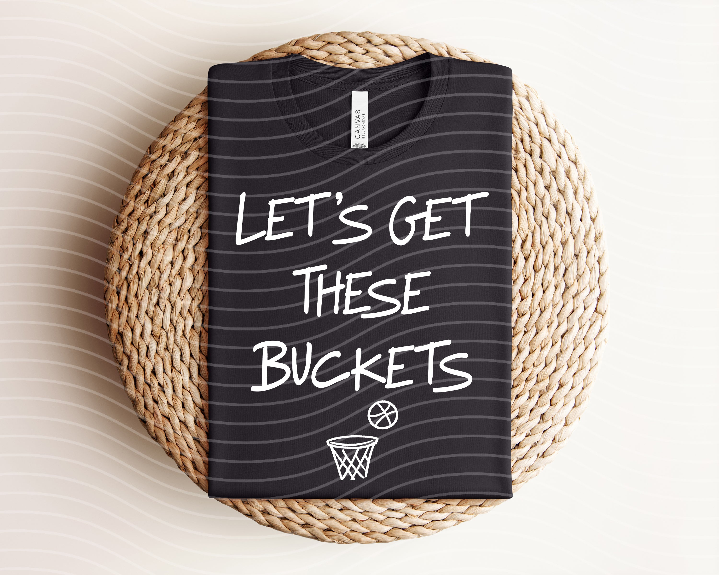 Let's Get These Buckets graphic tee by Anchored Grace Boutique, white cotton t-shirt with bold black text graphic.