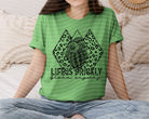 Life is Prickly Bloom Anyway graphic tee from Anchored Grace Boutique, featuring a colorful floral and cactus design on soft fabric.