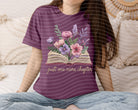 Black graphic tee from Anchored Grace Boutique with "Just One More Chapter" print, casual style, and comfortable fit.