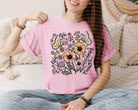 Spring floral graphic tee from Anchored Grace Boutique featuring colorful floral designs on a casual cotton shirt.