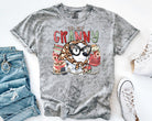 Black graphic tee featuring "In My Granny Era" text, stylish casual shirt by Anchored Grace Boutique, displayed on a hanger.