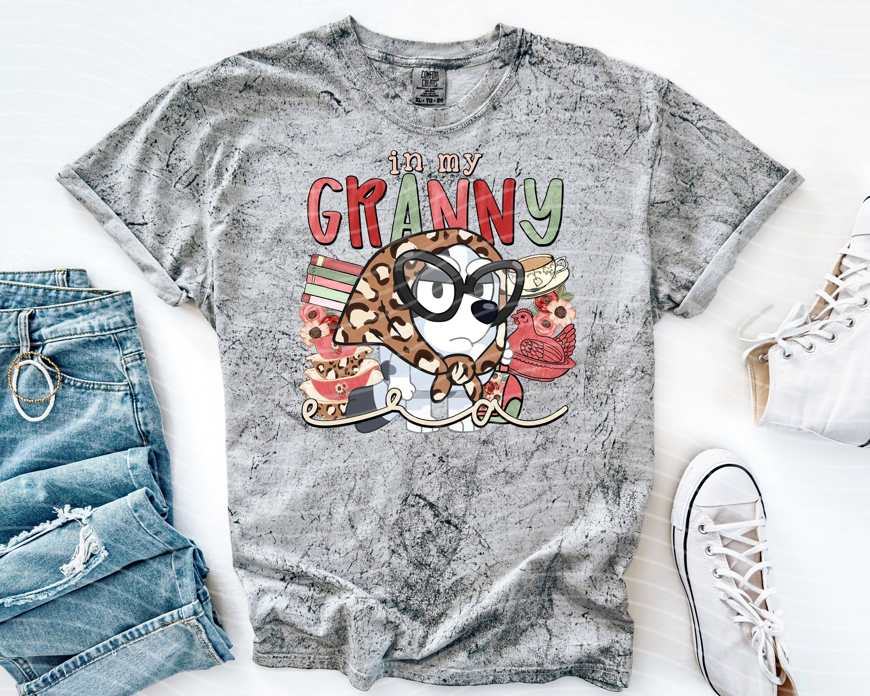 Black graphic tee featuring "In My Granny Era" text, stylish casual shirt by Anchored Grace Boutique, displayed on a hanger.