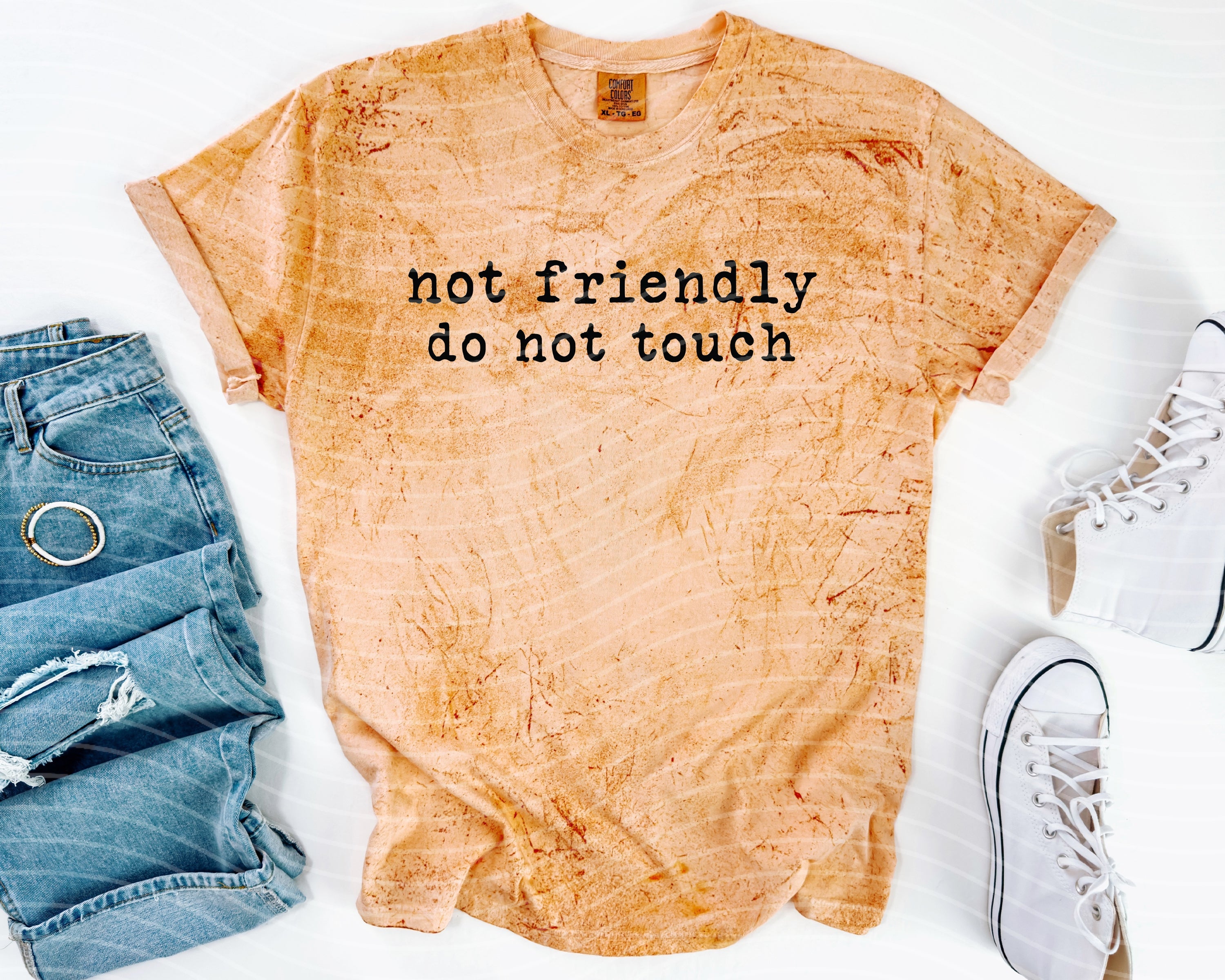 Black graphic tee by Anchored Grace Boutique featuring bold "Not Friendly Do Not Touch" text on the front.