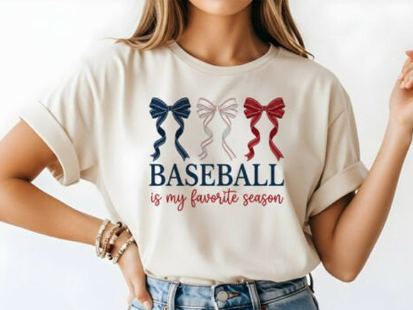 Graphic tee featuring a baseball design with the phrase "Baseball is My Favorite Season" by Anchored Grace Boutique.