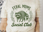 Feral Moms Social Club graphic tee in black with bold white text, casual short-sleeve T-shirt from Anchored Grace Boutique.