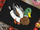 Patchwork duck graphic tee from Anchored Grace Boutique featuring colorful patchwork duck design on a casual cotton t-shirt.