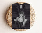 Black and white TS graphic tee from Anchored Grace Boutique, featuring bold graphic design on a casual cotton T-shirt.