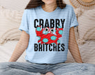 Crabby Britches graphic tee by Anchored Grace Boutique featuring a playful crab illustration on a casual T-shirt.
