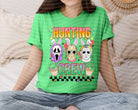 Hunting Crew graphic tee by Anchored Grace Boutique featuring a stylish hunting-themed design on a casual t-shirt.