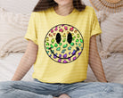 Leopard and happy face graphic tee by Anchored Grace Boutique, featuring a stylish design on a casual cotton t-shirt.