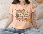 Black graphic tee by Anchored Grace Boutique featuring a colorful design inspired by fictional characters for fans of storytelling.