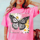Painted butterfly graphic tee from Anchored Grace Boutique featuring vibrant butterfly artwork on a casual graphic tee.