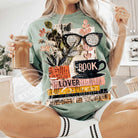 Book Lover Graphic Tee by Anchored Grace Boutique featuring a stylish literary-themed design on a casual t-shirt.