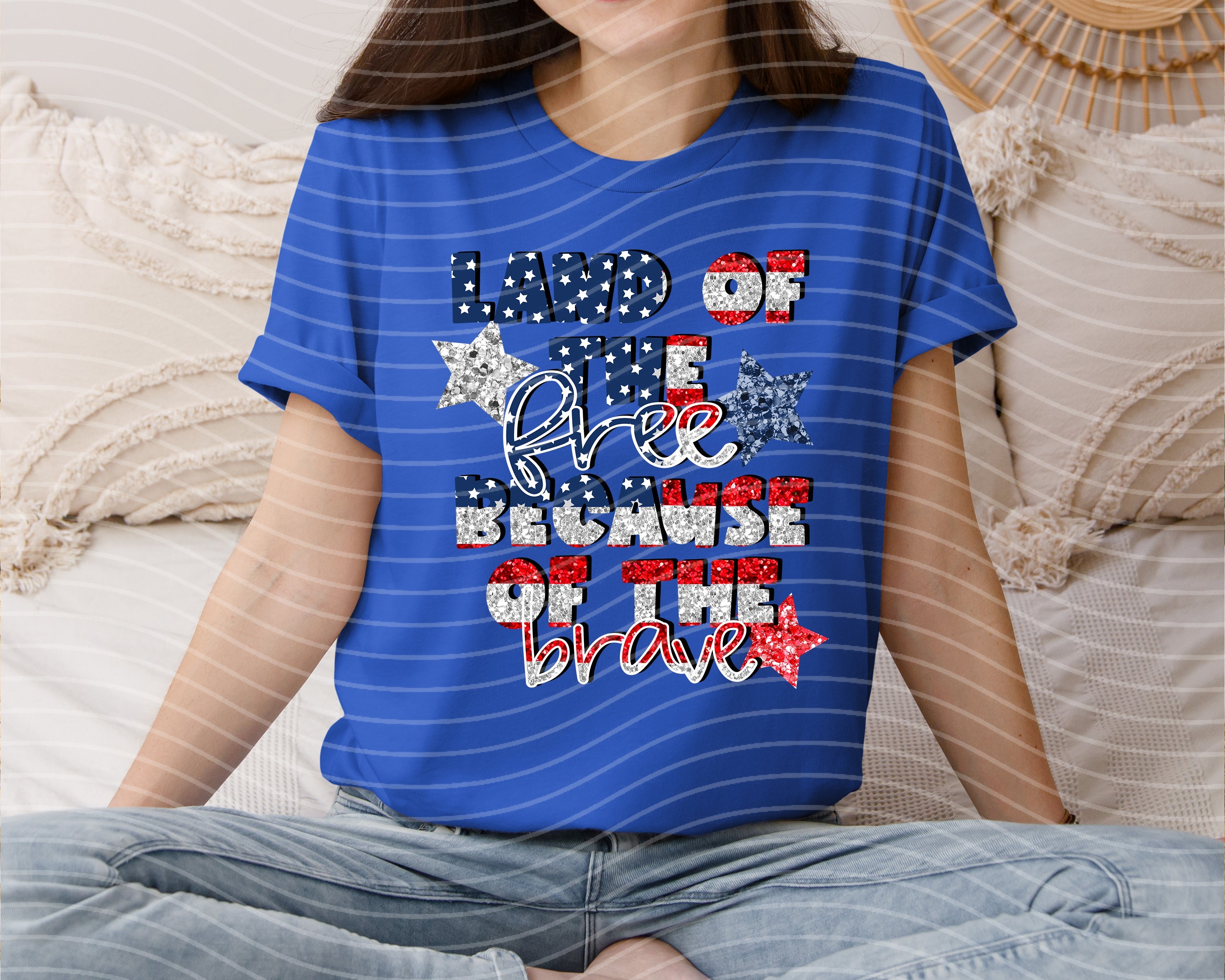 Anchored Grace Boutique Land of the Free Because of the Brave graphic tee featuring patriotic design and bold text.