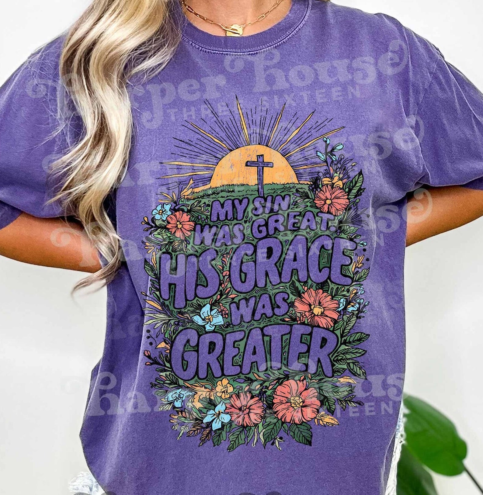 Black graphic tee from Anchored Grace Boutique featuring a heartfelt "My Sin Was Great His Love Was Greater" design.