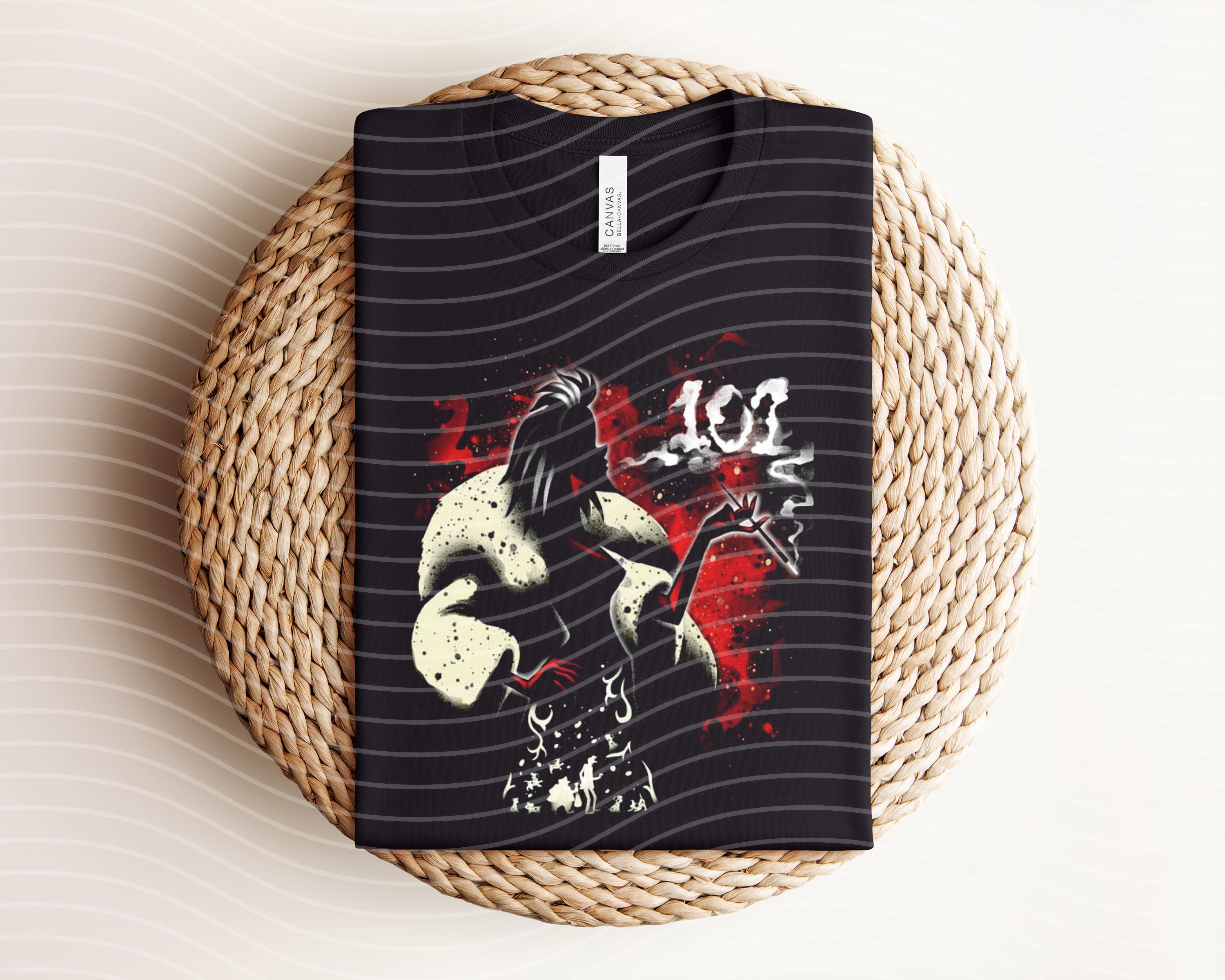 Dark graphic tee featuring Cruella design from Anchored Grace Boutique, showcasing bold black and white artwork on soft fabric.