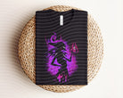 Dark graphic tee featuring Yzma design from Anchored Grace Boutique, with bold print and casual fit.