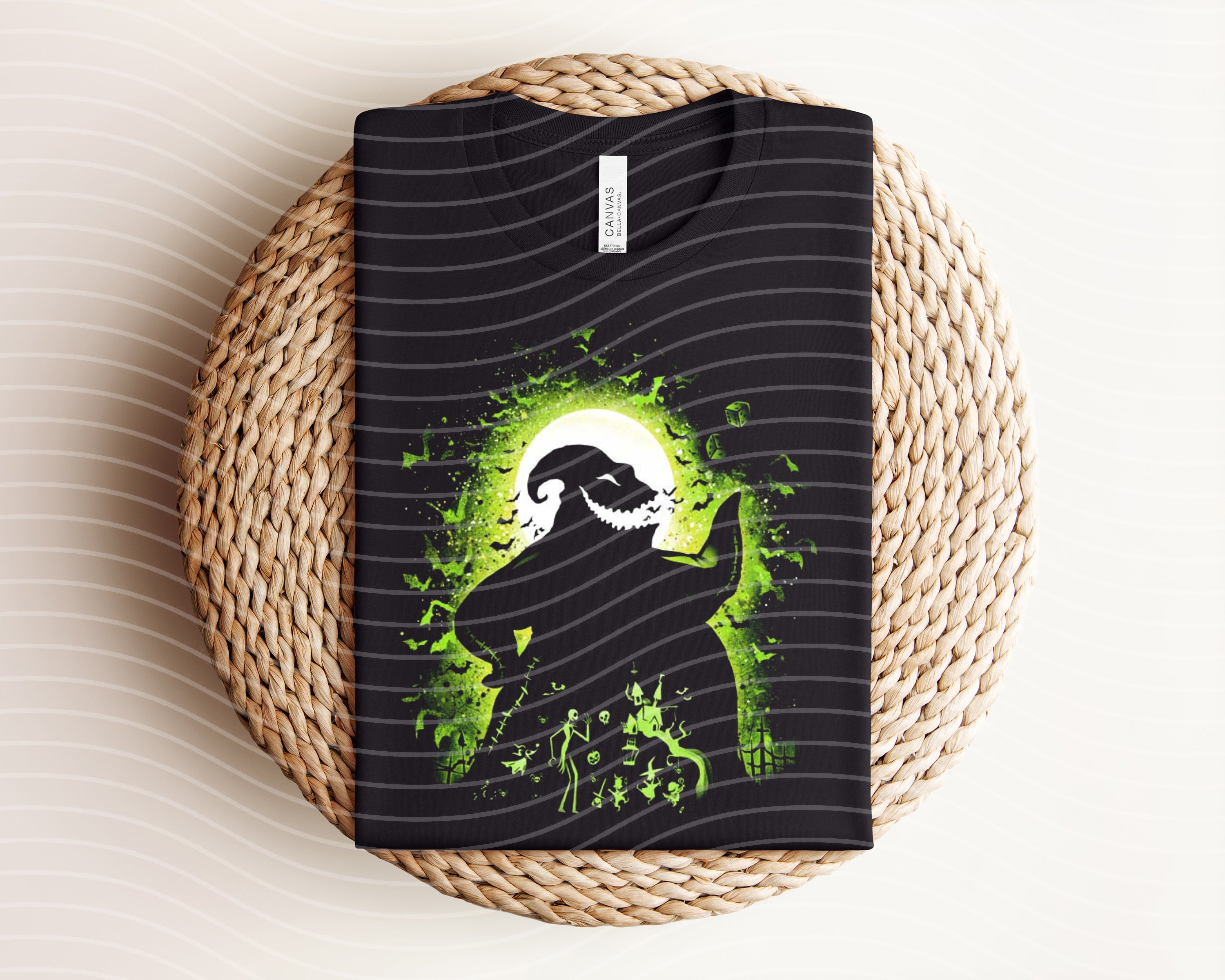 Oogie Boogie dark graphic tee from Anchored Grace Boutique featuring a spooky cartoon design on black fabric.