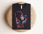 Black hook graphic tee from Anchored Grace Boutique featuring dark, artistic graphic design on a casual cotton t-shirt.