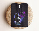 Alice Dark Graphic Tee by Anchored Grace Boutique, featuring a stylish dark-colored graphic design on a casual t-shirt.