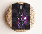 Black Meg Dark Graphic Tee by Anchored Grace Boutique featuring a bold graphic design on soft cotton fabric.