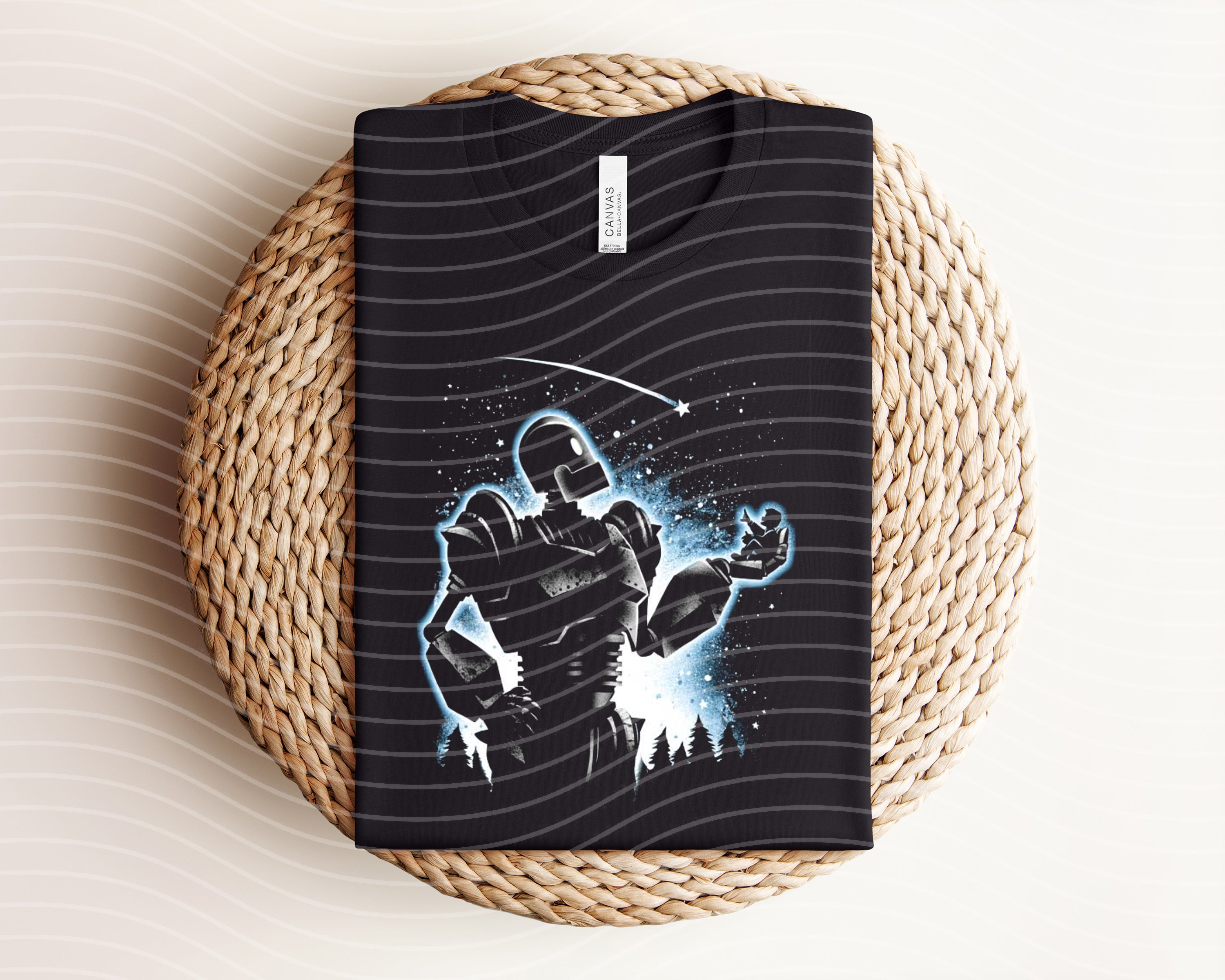 Dark graphic tee featuring Iron Giant design from Anchored Grace Boutique, showcasing a detailed illustration on soft fabric.