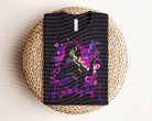 Sarah Dark Graphic Tee from Anchored Grace Boutique, close-up of black graphic t-shirt with bold design and soft fabric texture.