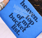 Gray graphic tee from Anchored Grace Boutique featuring "Top of My Bucket List" design, casual fit, and vibrant print.