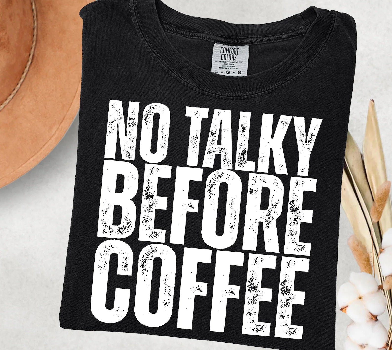 No Talky Before Coffee graphic tee by Anchored Grace Boutique, featuring a stylish design on a casual cotton t-shirt.