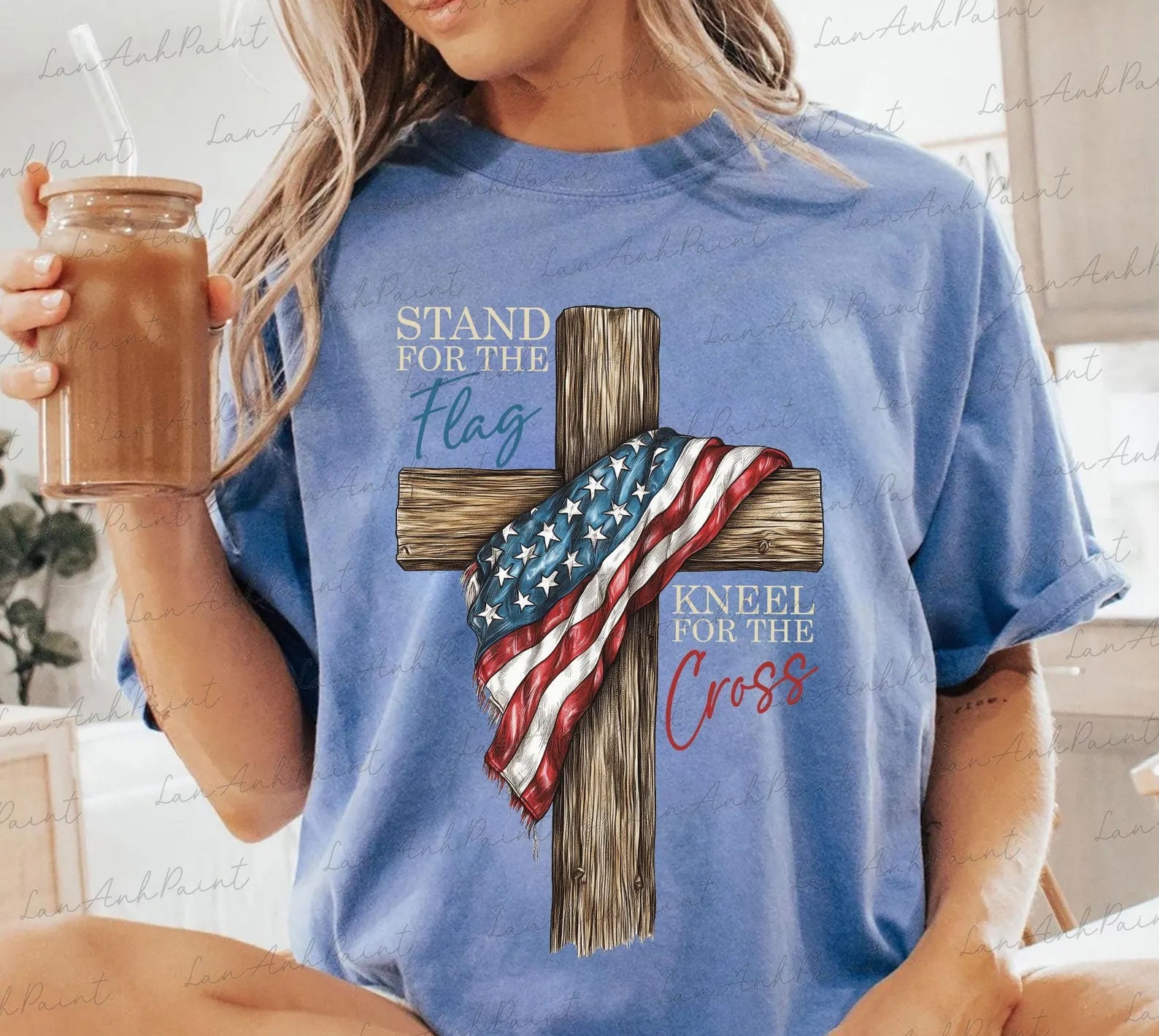 Graphic tee featuring a kneeling figure and cross design from Anchored Grace Boutique's Stand for the Flag Kneel for the Cross collection.