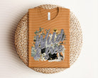 Wild & Free graphic tee by Anchored Grace Boutique, featuring a stylish casual design and vibrant print on soft fabric.