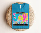 Black graphic tee from Anchored Grace Boutique with "I've Got the Joy Down in My Heart" print, casual and stylish.