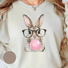 Pink bubblegum bunny graphic tee by Anchored Grace Boutique, featuring a playful bunny design on a casual cotton t-shirt.