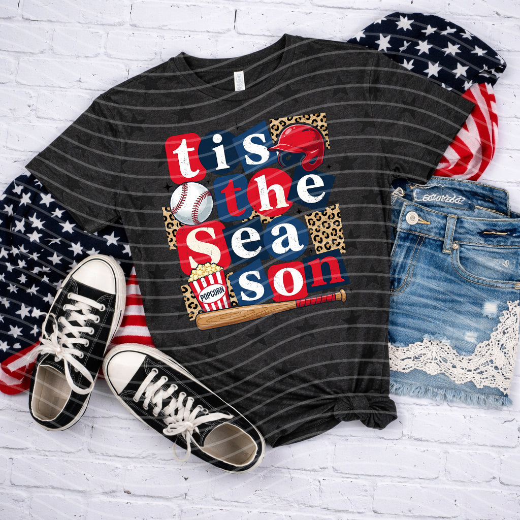 Gray "Tis the Season" graphic tee by Anchored Grace Boutique featuring festive holiday design and comfortable cotton fabric.