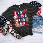 Gray "Tis the Season" graphic tee by Anchored Grace Boutique featuring festive holiday design and comfortable cotton fabric.
