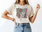 Graphic tee featuring Book Girl design from Anchored Grace Boutique, with a stylish illustration on soft fabric.